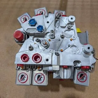 Fuel control assembly with torque-motor handling covers